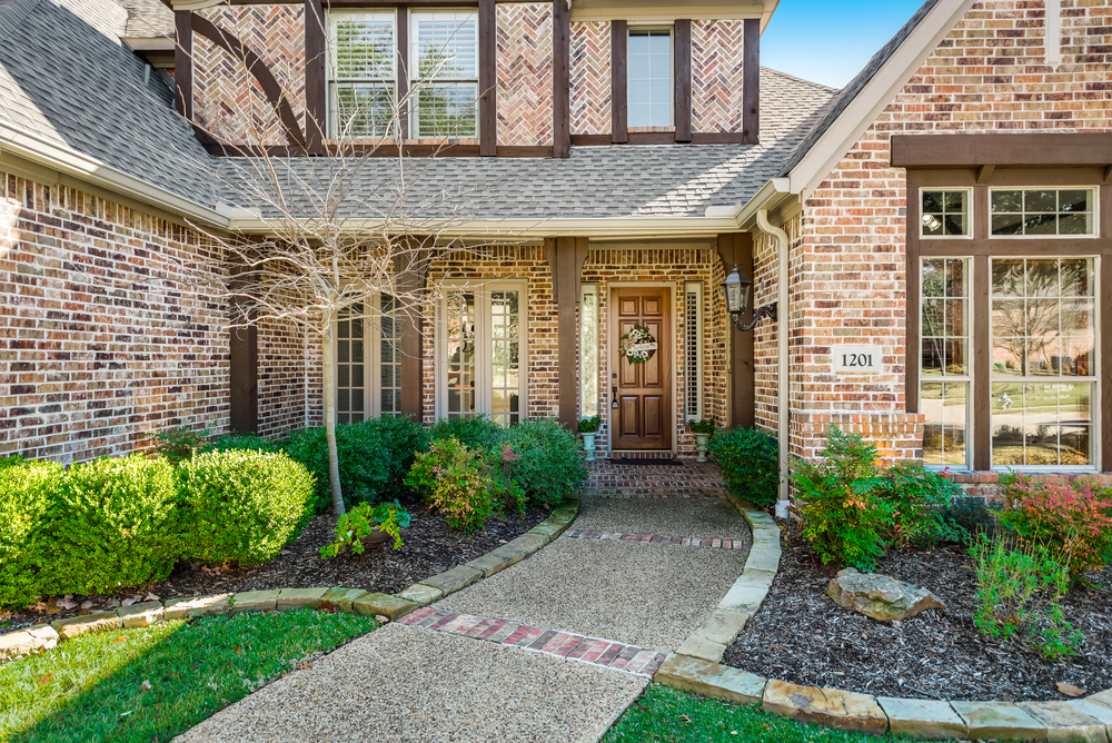   Cozy Front Porch and Lush Landscaping 