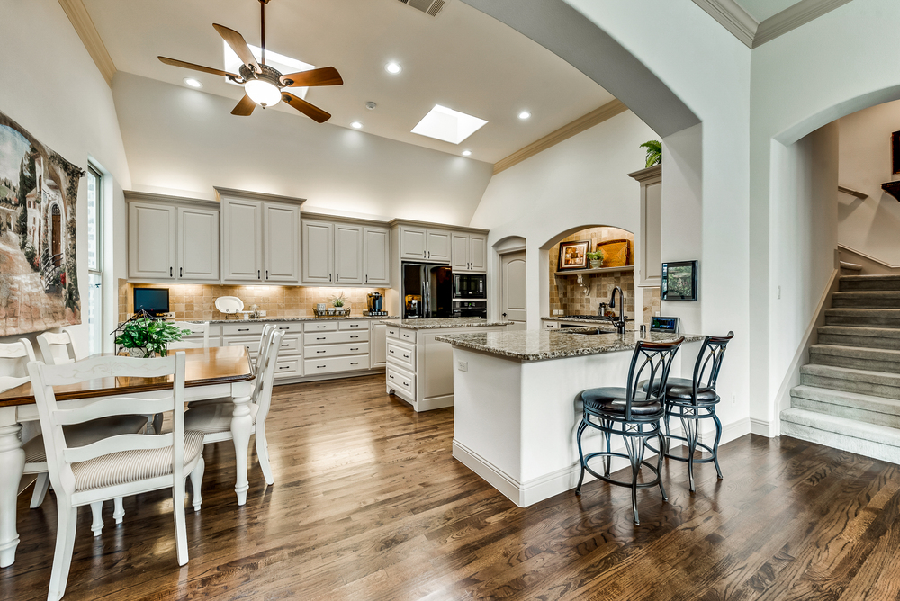    Gourmet Kitchen with Granite Countertops and Soaring Ceilings 
