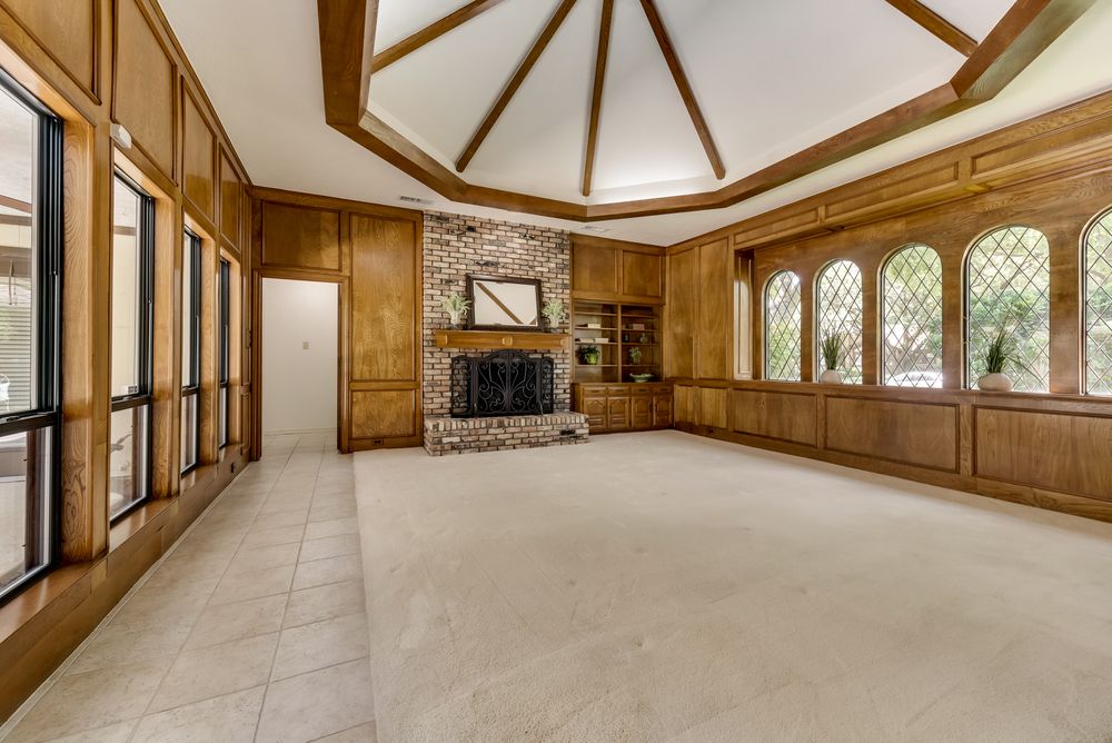    Formal Living or Family Room has Brick Gas Log Fireplace and Built In Cabinetry 