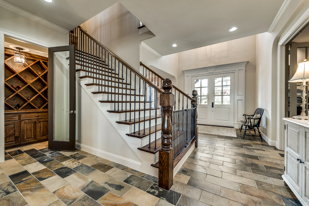    Wine Closet and Wrought Iron Spindle Stairway 