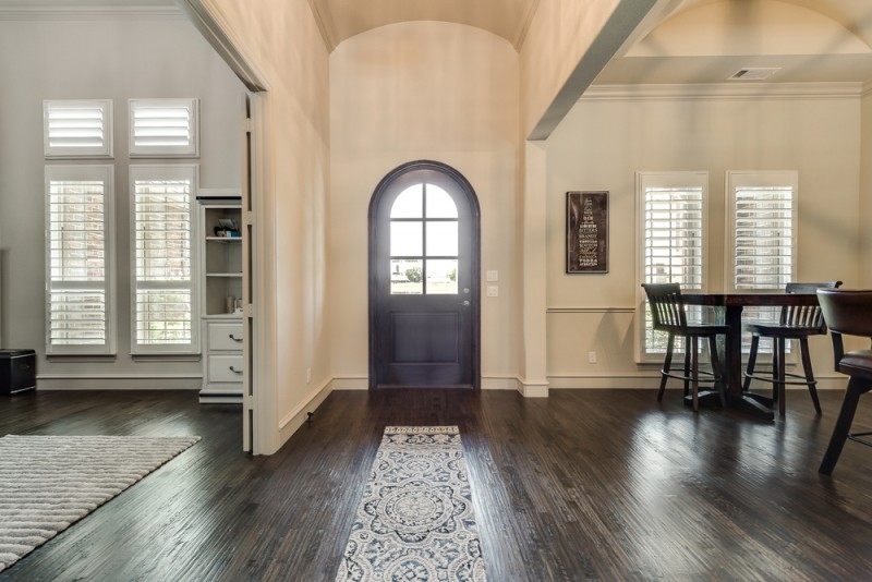    Gorgeous Custom Front Door and Soaring Ceilings Welcome you Home 