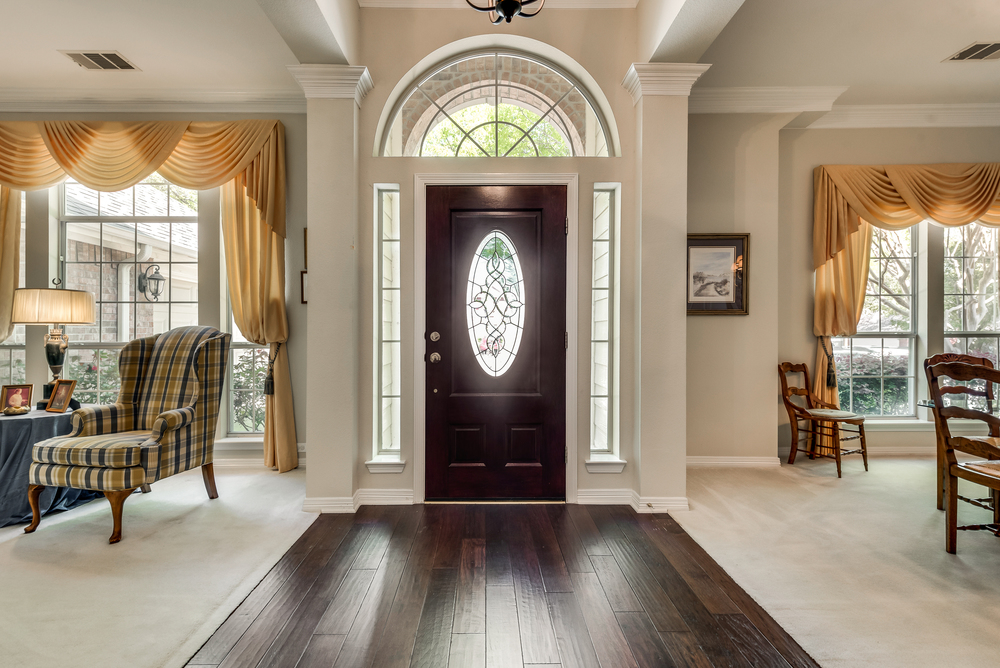    Entry with Hardwood Floors flanked by Formal Living and Formal Dining 