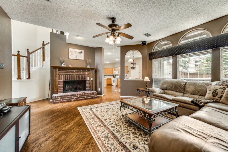    Spacious Family Room with Brick Gas Log Fireplace 