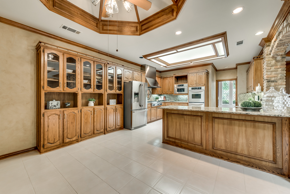    Chef s Kitchen offers Abundance of Built In Cabinetry with Under Mount Lighting 