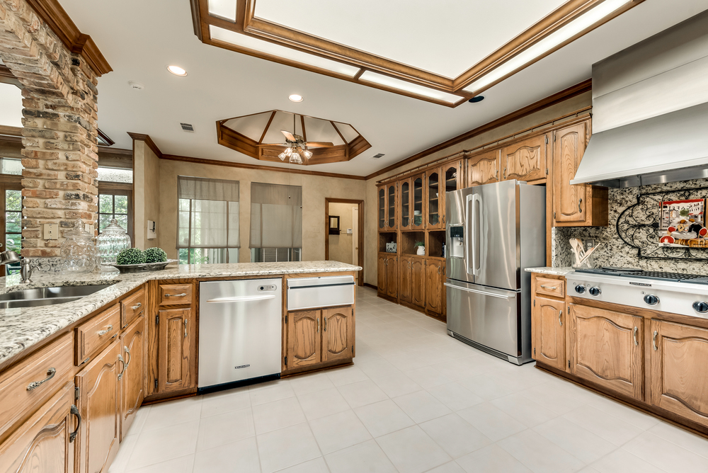    Gorgeous Sky Light Granite Countertops and Stainless Steel Appliances 