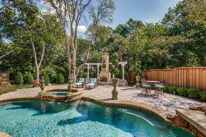    Extensive Pool Deck with stone fireplace 