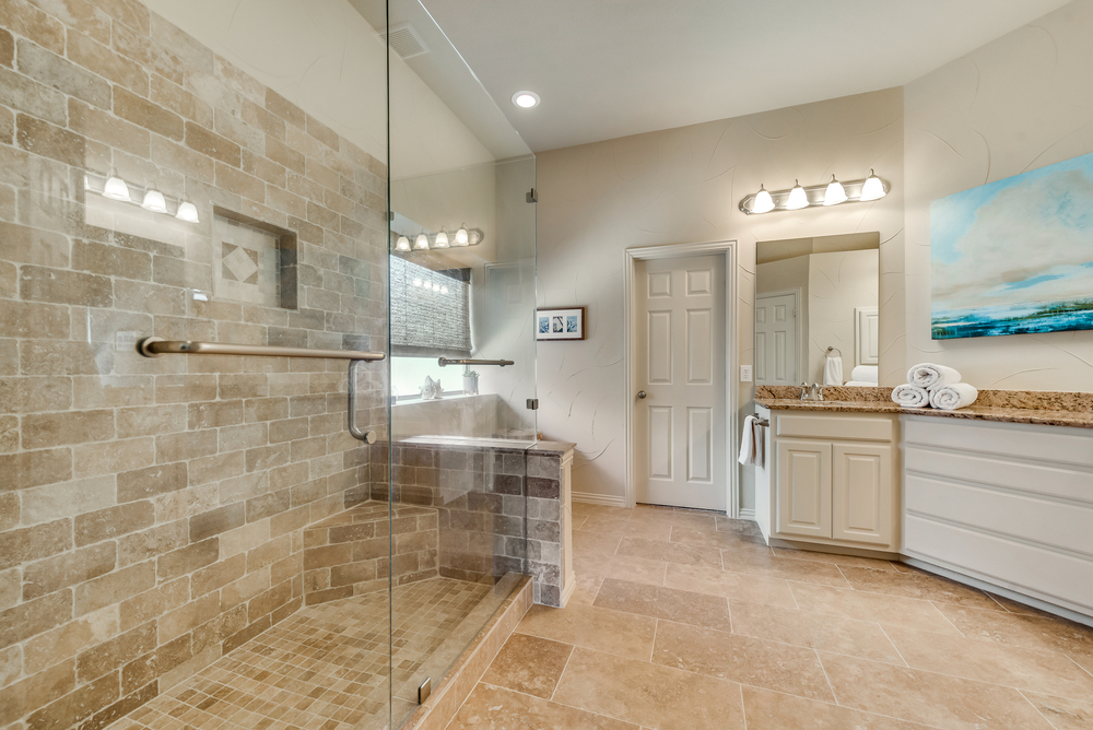    Updated Master Bathroom with Large Seamless Glass Shower 