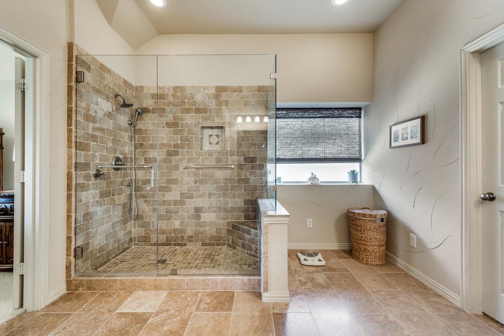    Updated Master Bathroom with Large Seamless Glass Shower 