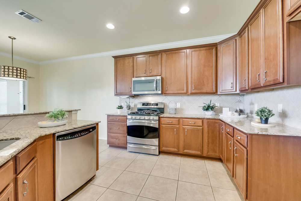    Chefs Kitchen offers Granite Countertops Abundance of Wood Cabinetry 