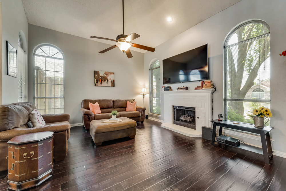    Family Room features Brick Gas Log Fireplace and Great Natural Light 
