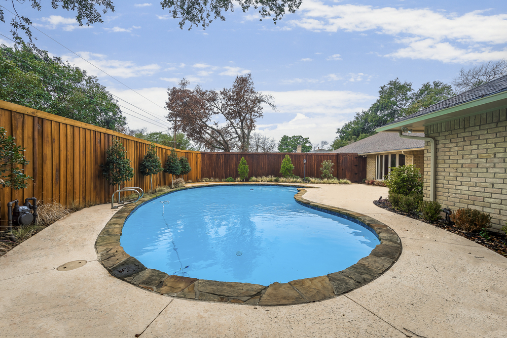    Backyard Oasis with Mature Trees  Sparkling Swimming Pool and Covered and Extended Patio 