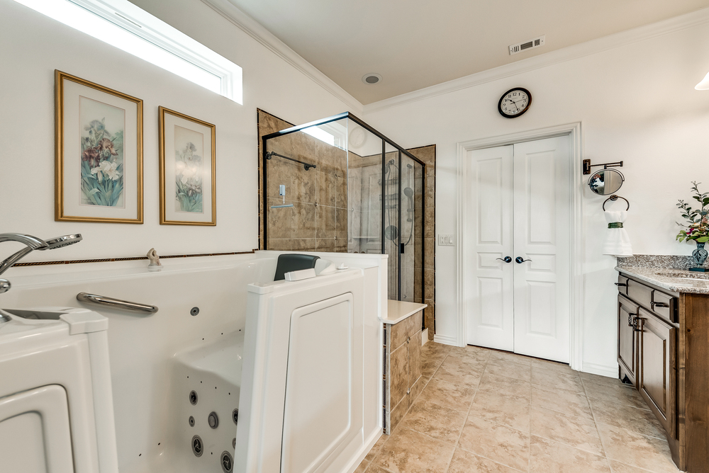    Spa Like Master Bathroom has Walk In Jetted American Standard Tub and Separate Shower 