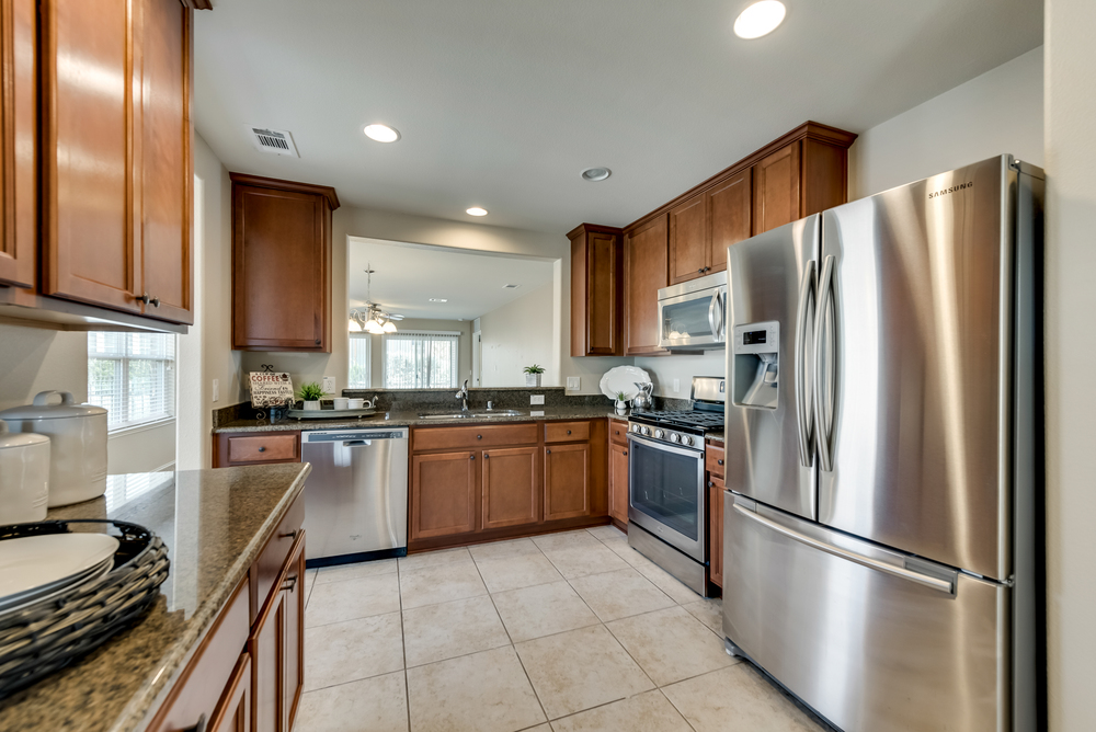    Chef s Kitchen with Granite Countertops and Stainless Steel Appliances 