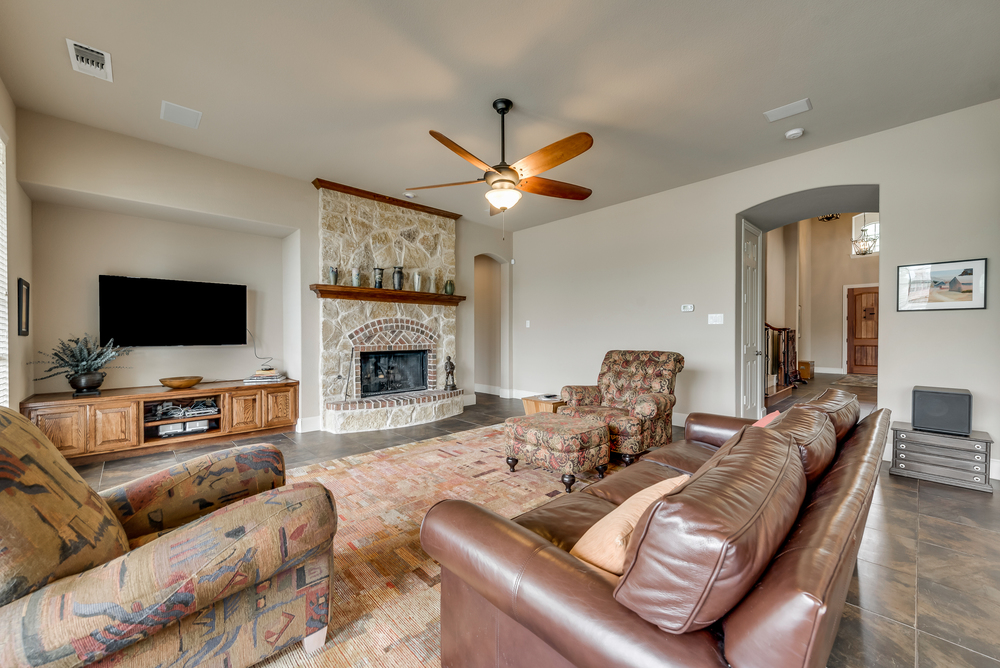    Inviting Family Room with Stone Fireplace 