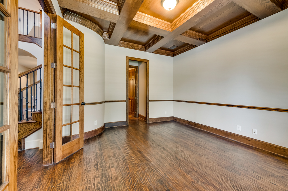    Richly Appointed Study with Coffered Ceiling and Private Access to Half Bathroom 