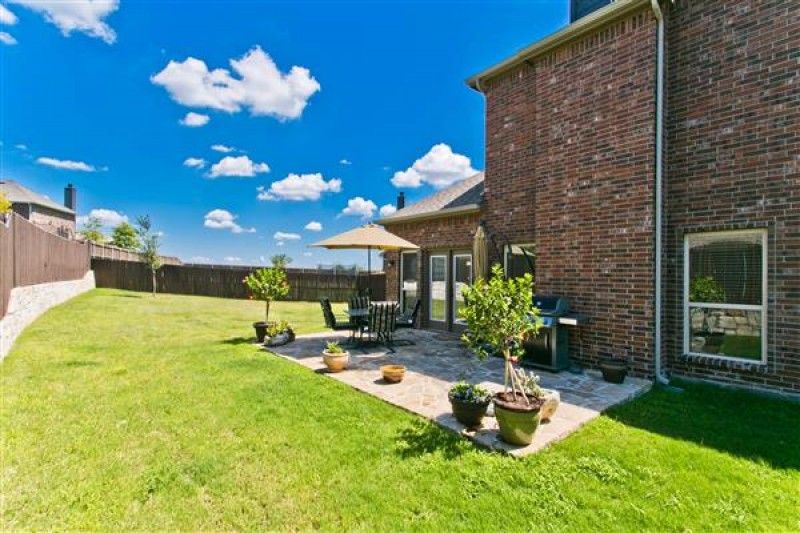    Large Grass Yard with Open Patio 